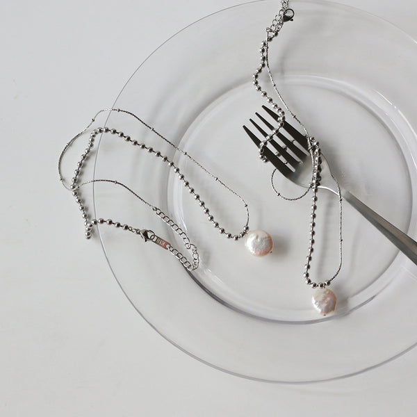 A necklace with a perfect combination of silver bead chains and pure natural pearls