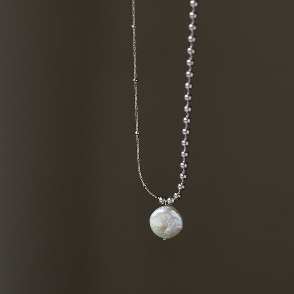 A necklace with a perfect combination of silver bead chains and pure natural pearls