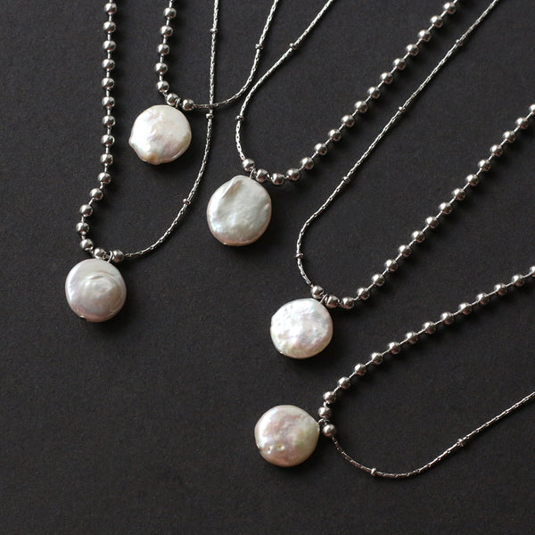 A necklace with a perfect combination of silver bead chains and pure natural pearls