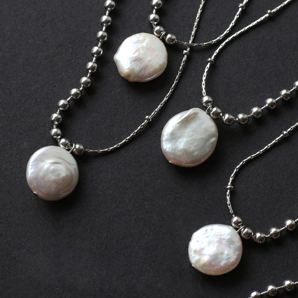 A necklace with a perfect combination of silver bead chains and pure natural pearls